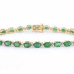 Geelgouden tennisarmband met diamanten en smaragden