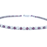 Witgouden tennisarmband met diamanten en robijnen
