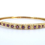 Gouden armband met diamanten en robijnen
