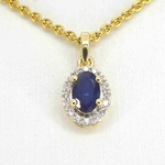 Gouden entourage hanger met diamanten en saffier, excl. ketting