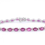 Witgouden tennisarmband met diamanten en robijn