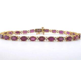 Gouden tennisarmband met natuurlijke diamanten en robijn