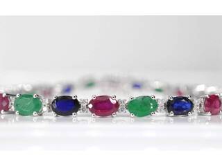 Witgouden tennisarmband met diamanten, saffier, robijn en smaragd