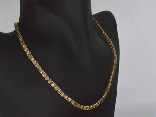 Gouden exclusieve tennis collier met champagne en cognac diamanten