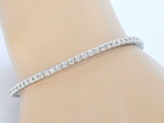 Witgouden armband met briljant geslepen diamanten en een onzichtbare s