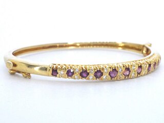 Gouden armband met diamanten en robijnen