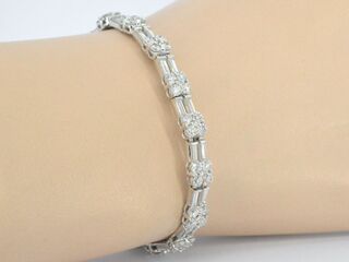 Gouden armband met briljant en baguette geslepen diamanten