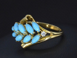 Gouden ring met diamant en blauwe edelsteen