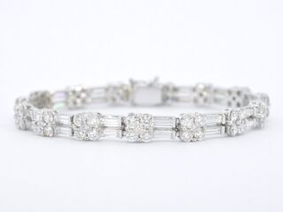 Gouden armband met briljant en baguette geslepen diamanten
