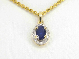 Gouden entourage hanger met diamanten en saffier, excl. ketting