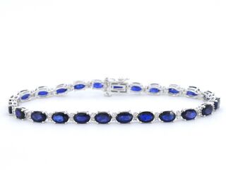 Witgouden tennisarmband met diamanten en saffier