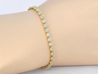 Gouden armband vol met diamanten gezet