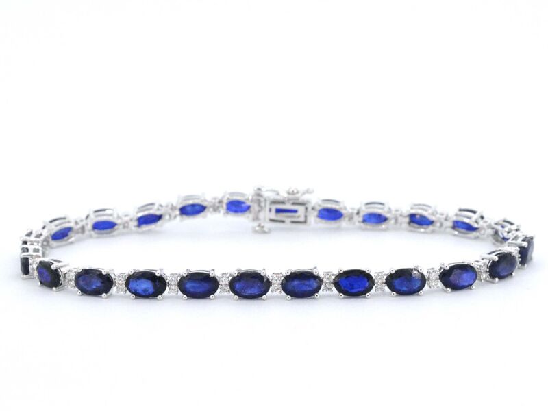 Witgouden tennisarmband met diamanten en saffier